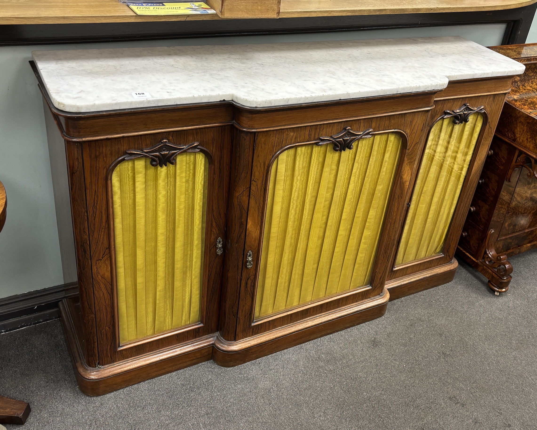 A Victorian marble topped rosewood breakfront bookcase, width 152cm, depth 42cm, height 168cm